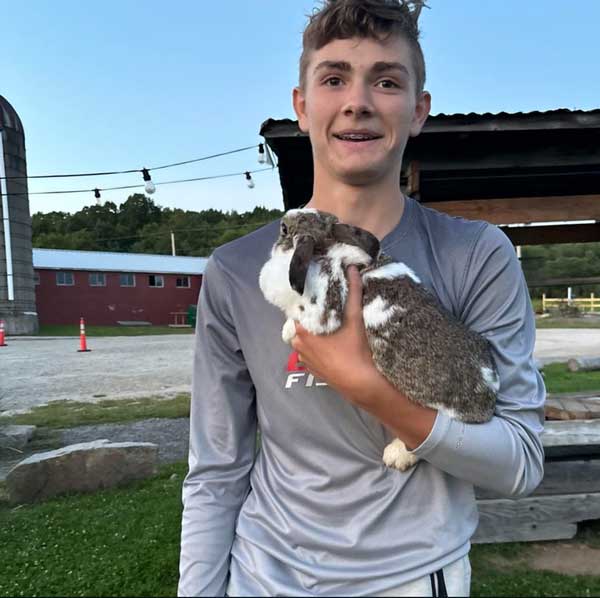 Cole-and-Latte a young man holding a rabbit